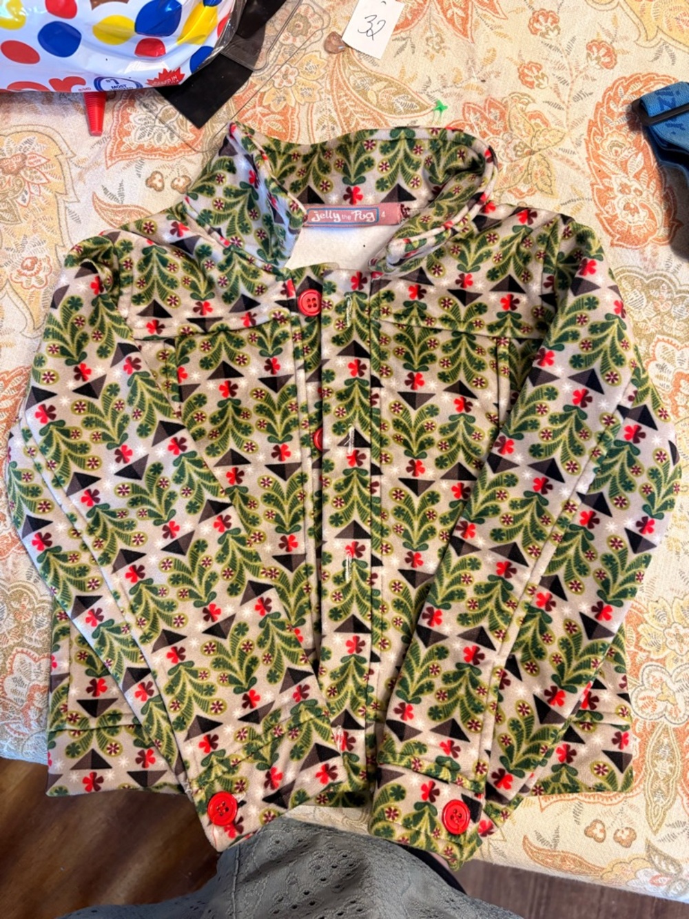 Jelly The Pug Green Patterned Hooded Jacket with Red Accents. Mint condition.